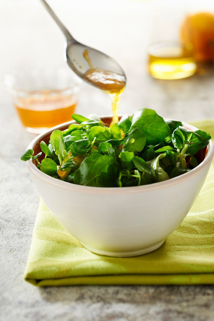 Corn lettuce and watercress salad with honey and orange zest vinaigrette