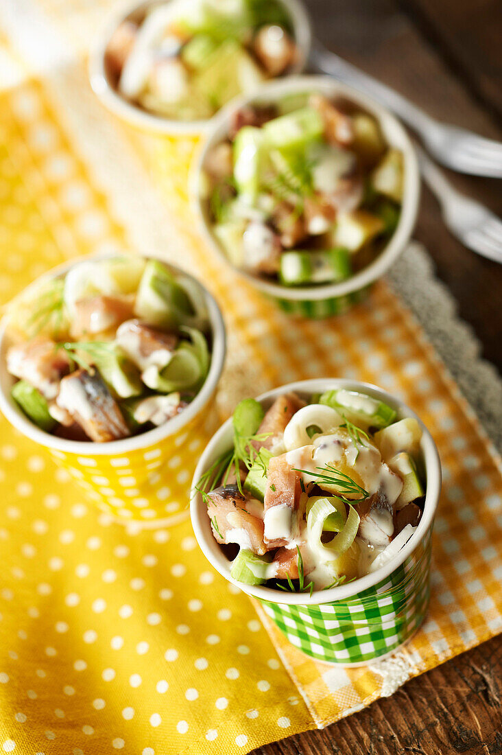 Potato,herring,celery stalk and green apple salad
