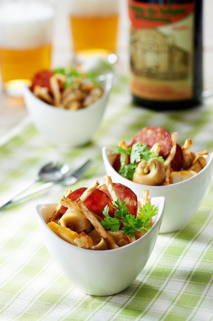 Whelk and haddock salad with lager, Morteau sausage crisps and fried celery