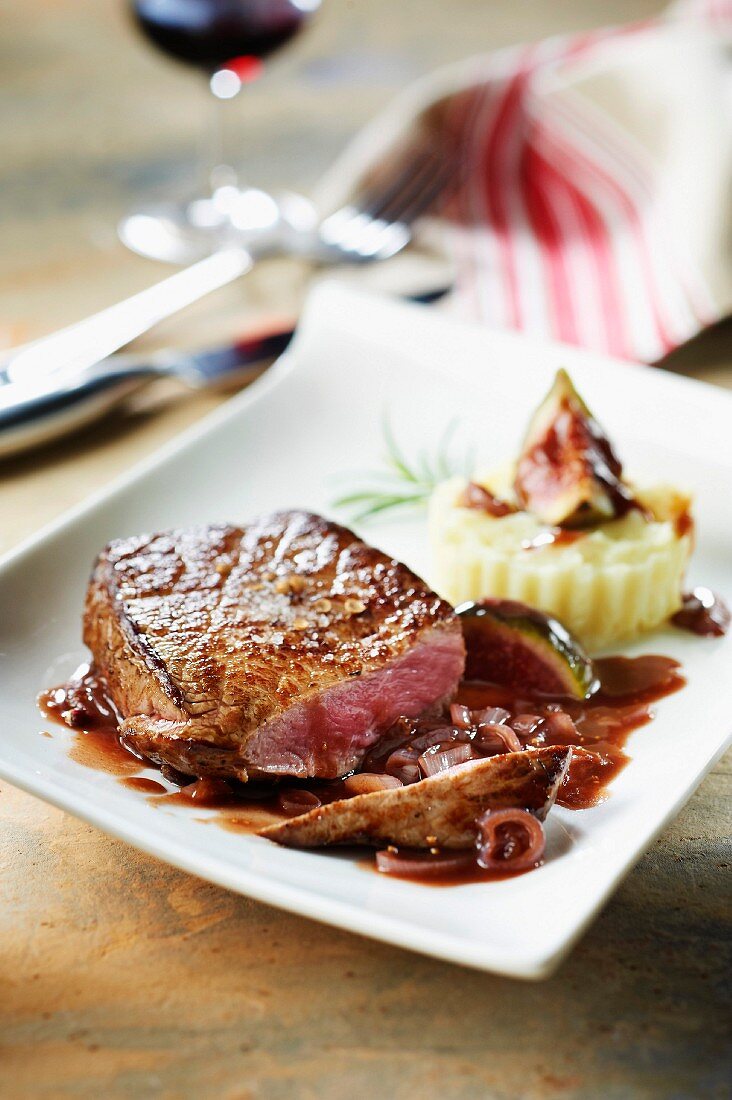 Thick beef steak with fig and kirsch sauce