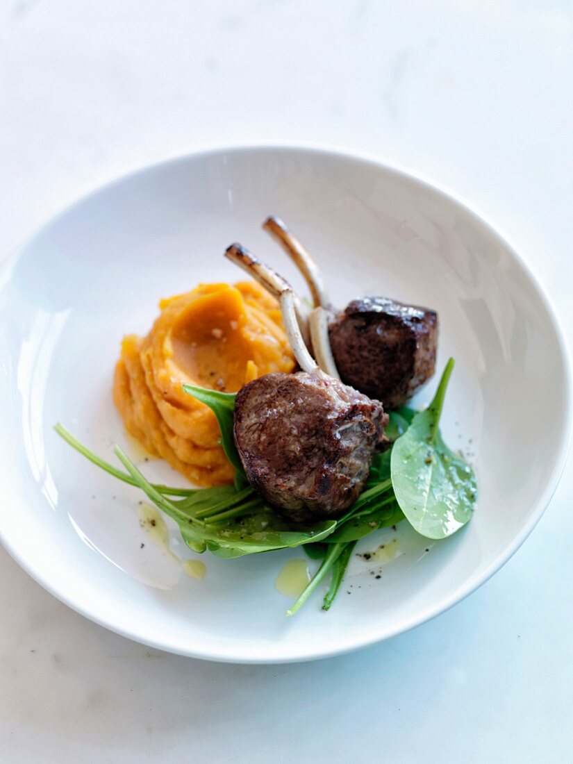 Lamb chops with pumpkin mash and baby spinach leaves