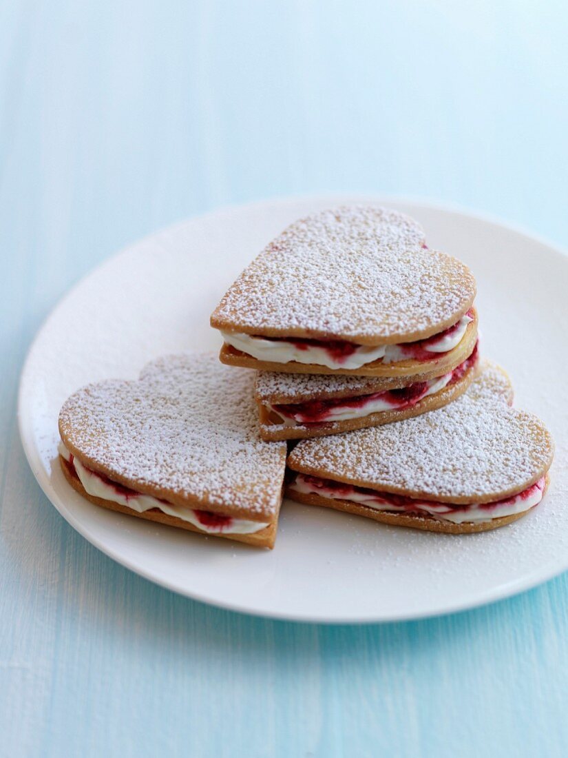 Raspberry and whipped cream crisp heart-shaped biscuits