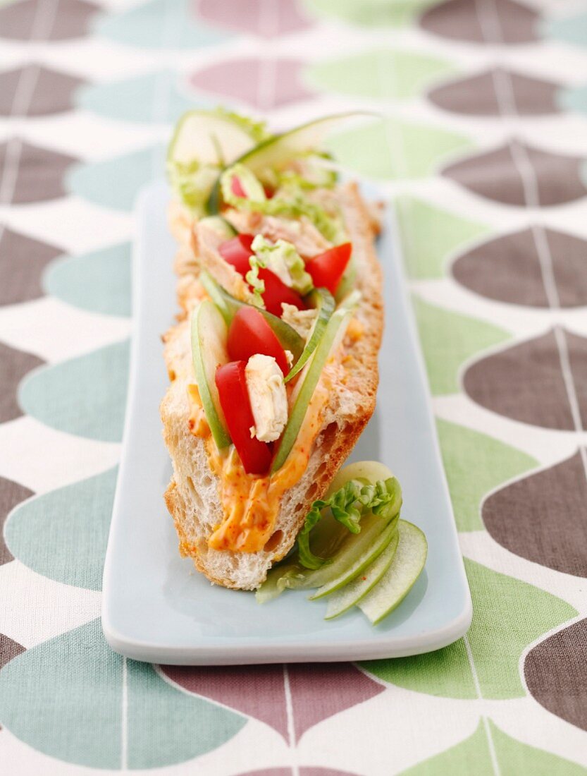 Chicken,Granny Smith apple and tomato sandwich with cocktail sauce