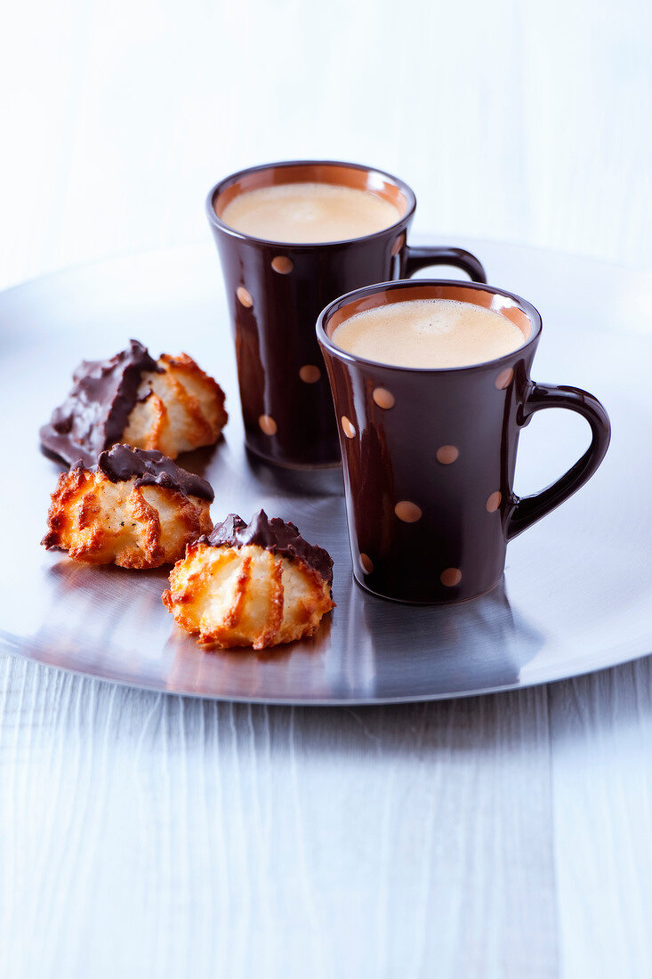 Cups of expresso coffee and coconut and chocolate Rochers
