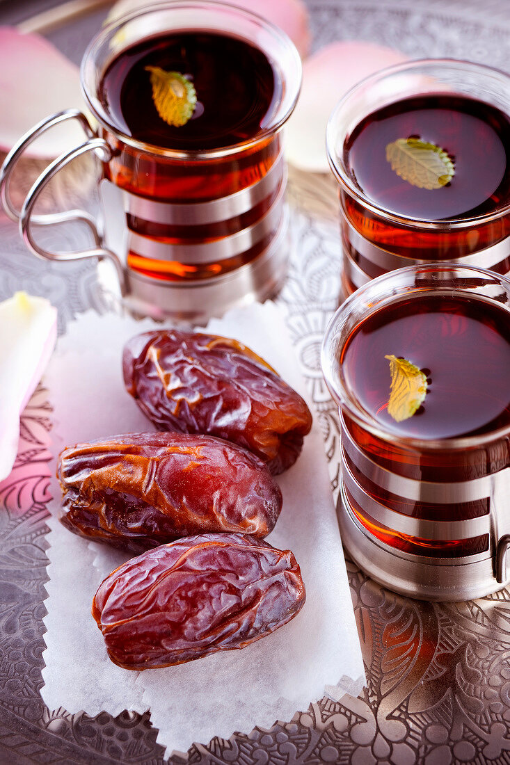 Dates and cups of tea on a tray