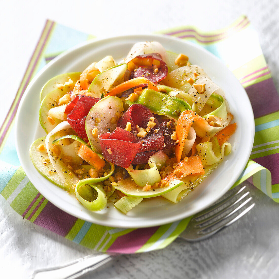 Thai salad with vegetable, meat and fruit strips