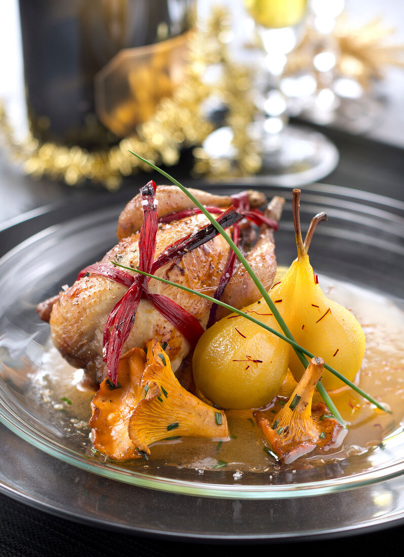 Roasted quail with saffron-flavored pears,chanterelles and honey sauce