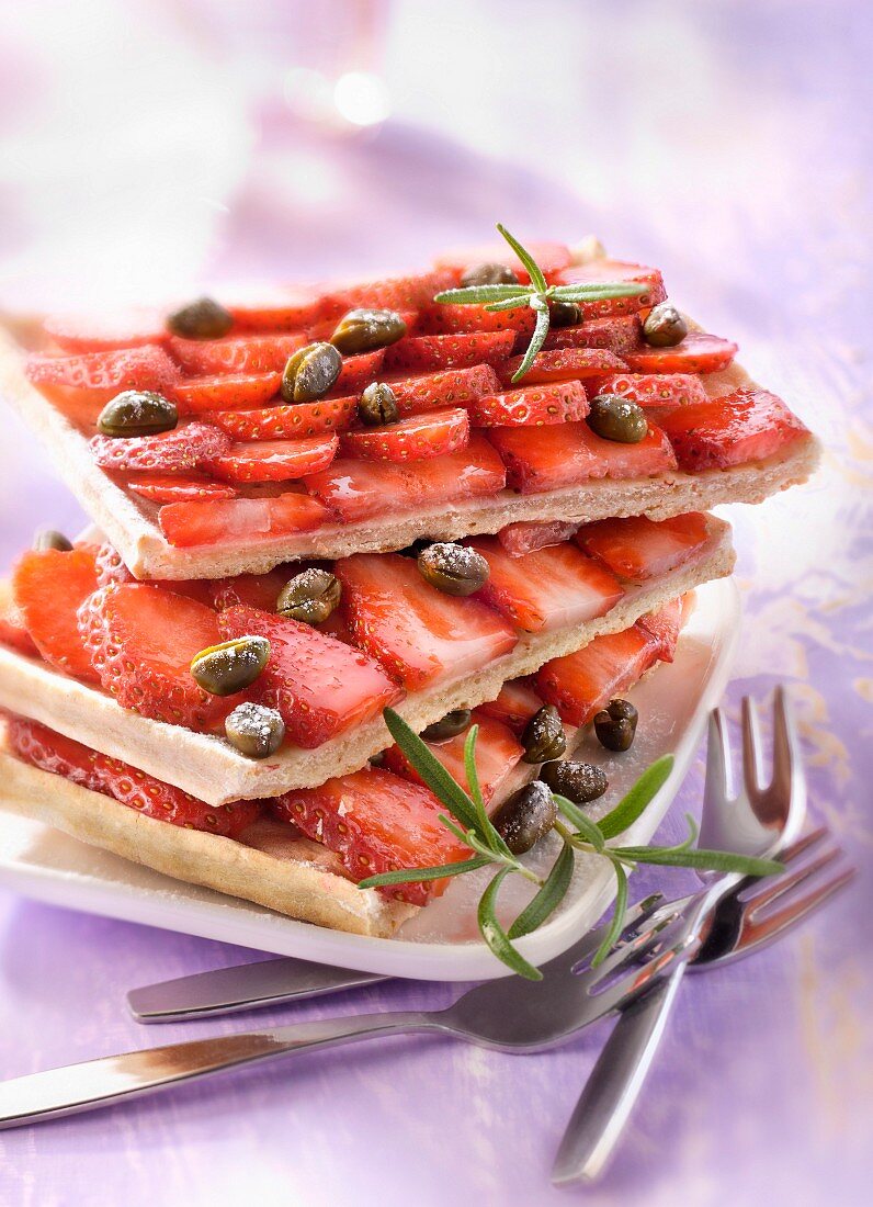 Strawberry and pistachio fine pastry slices of tart