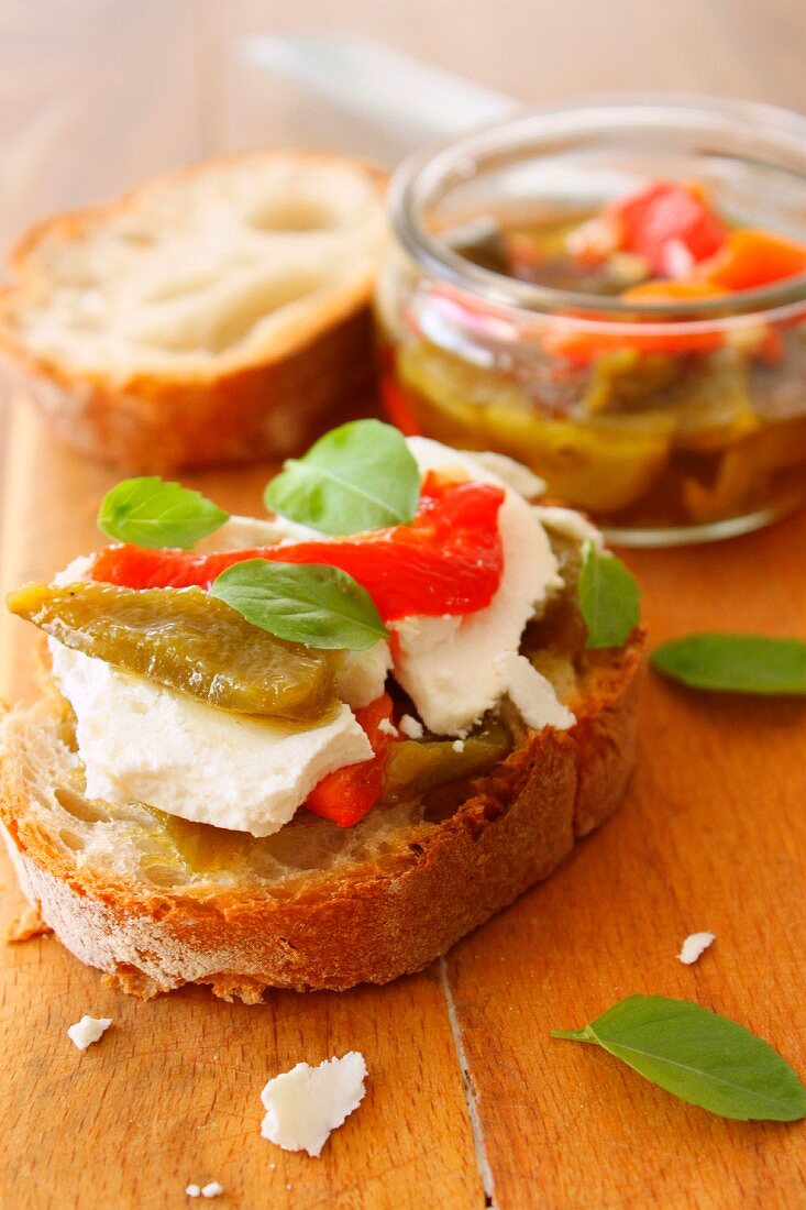 Fresh goat's cheese and pickled bell pepper open sandwich