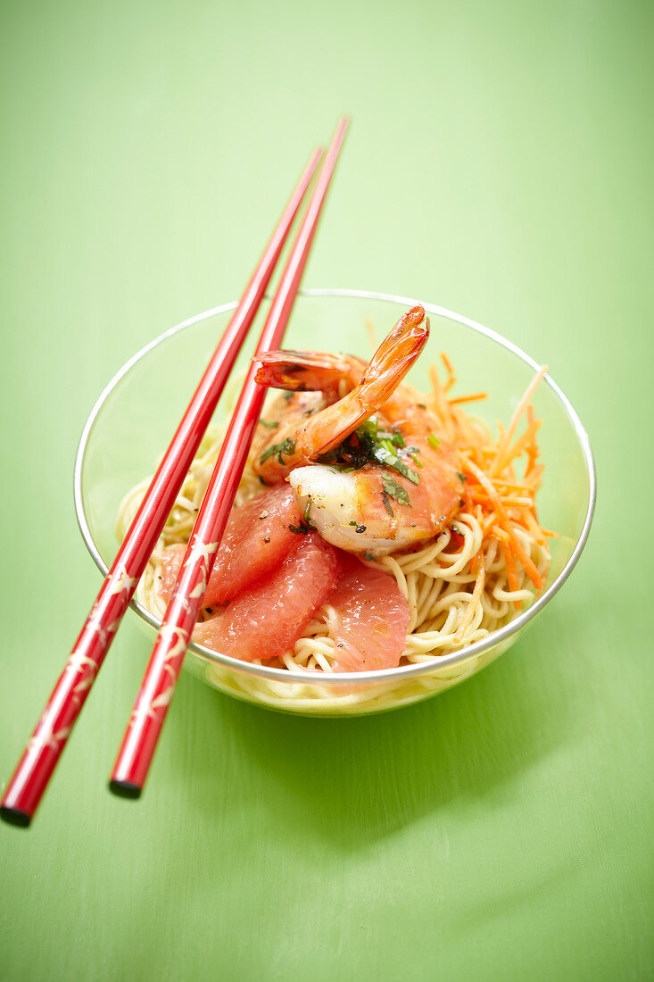 Noodle, shrimp, carrot and pink grapefruit exotic salad