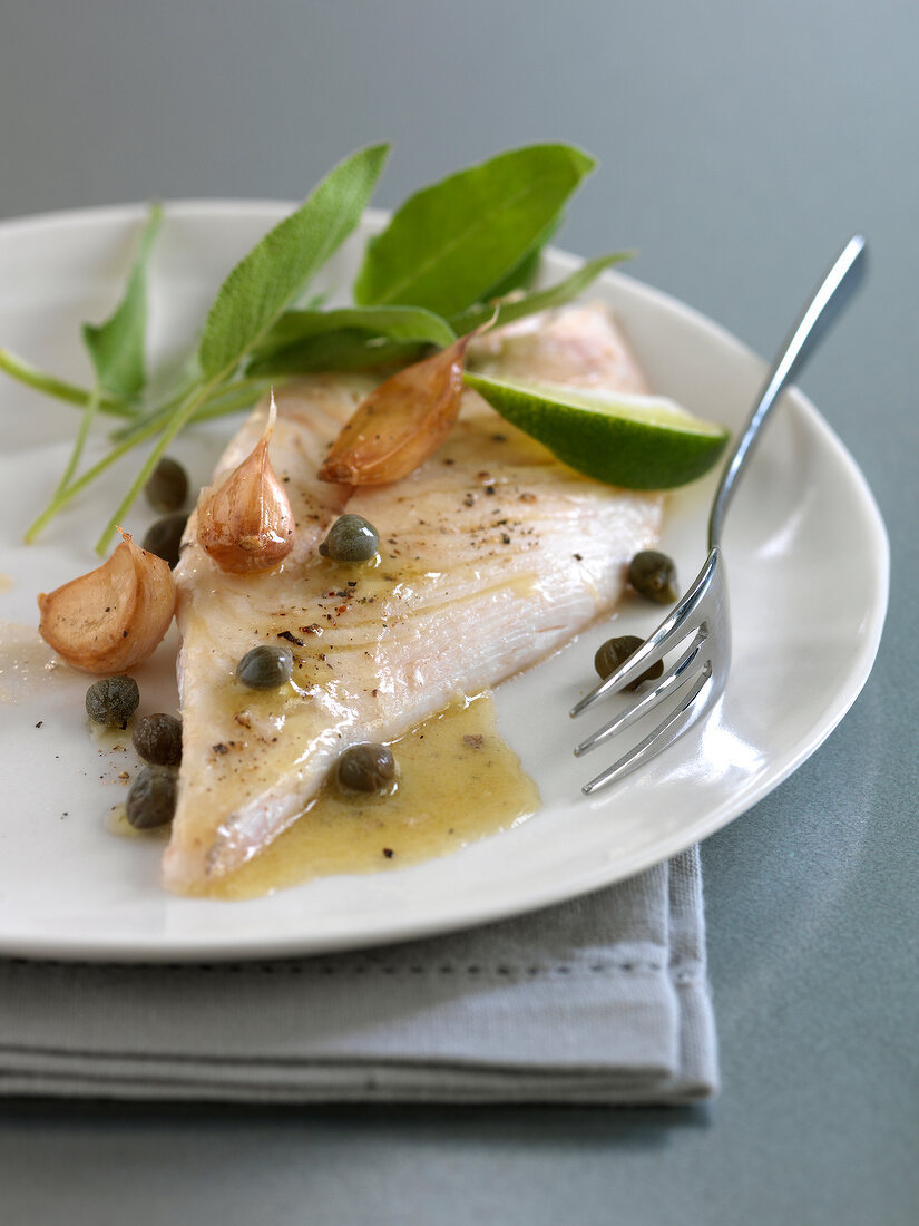 John Dory with caper butter and confit garlic cloves