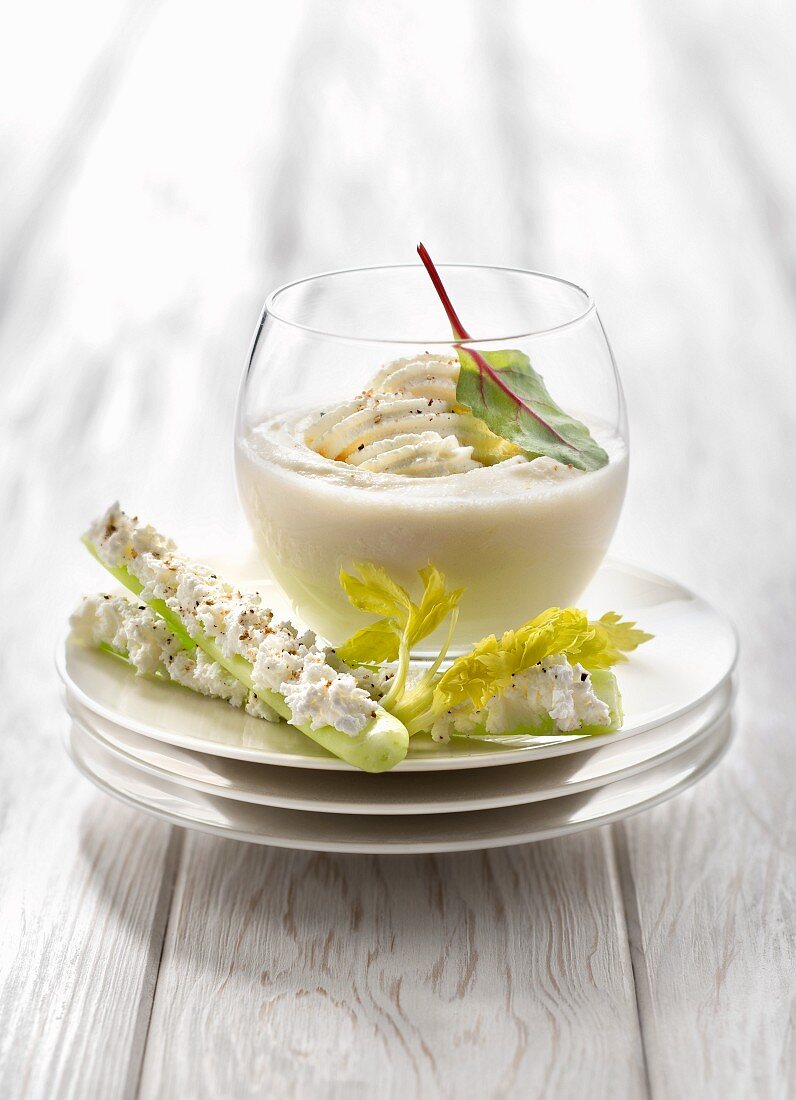 Celeriac cappuccino, celery stalks with goat's cheese