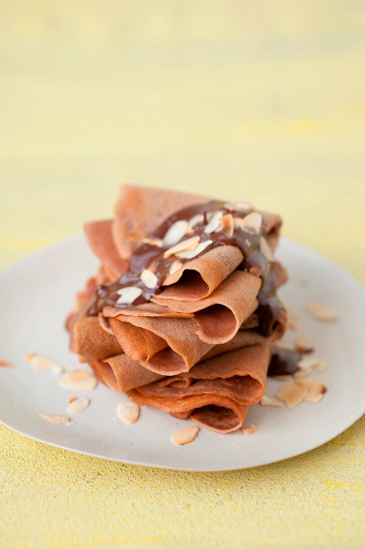 Chocolate crepes with thinly sliced almonds