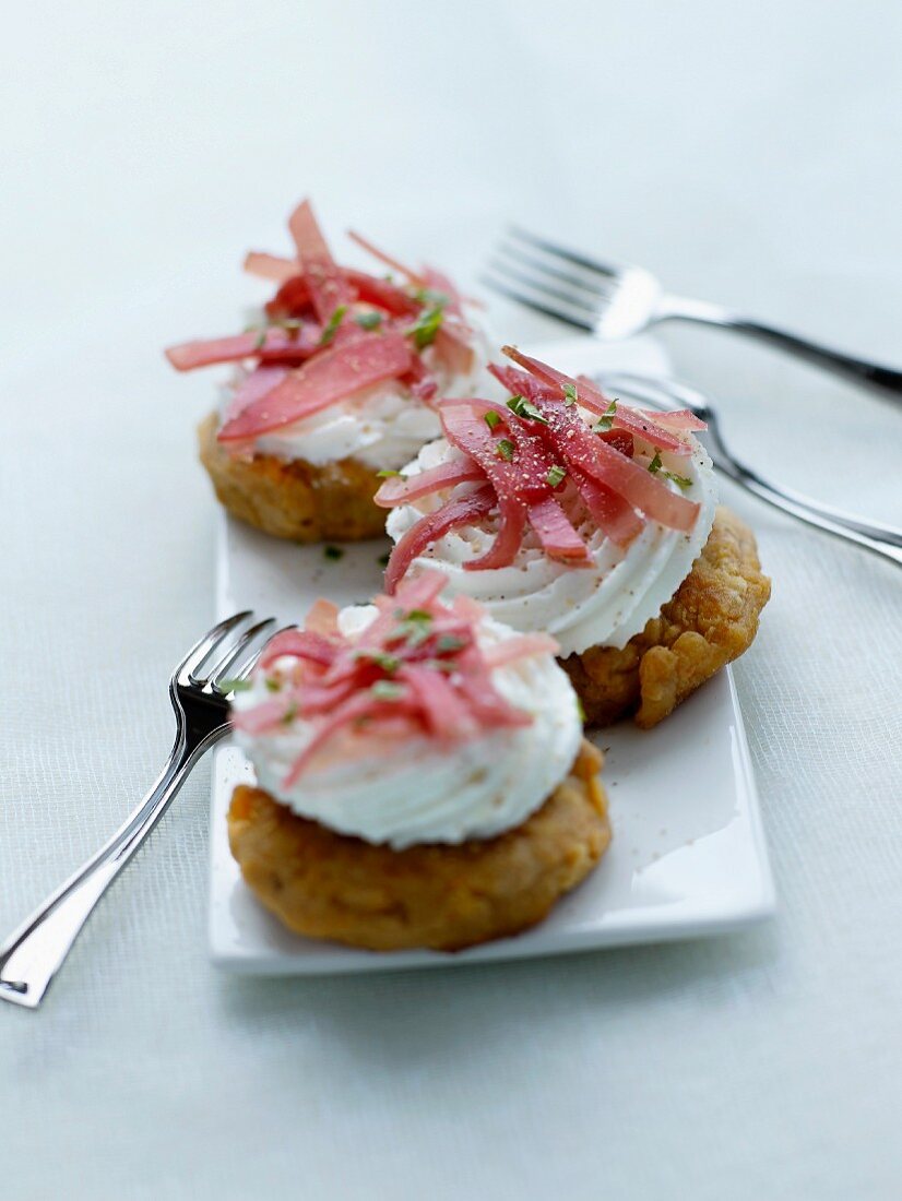 Eggplant fritters with salty whipped cream and short strips of Aoste ham