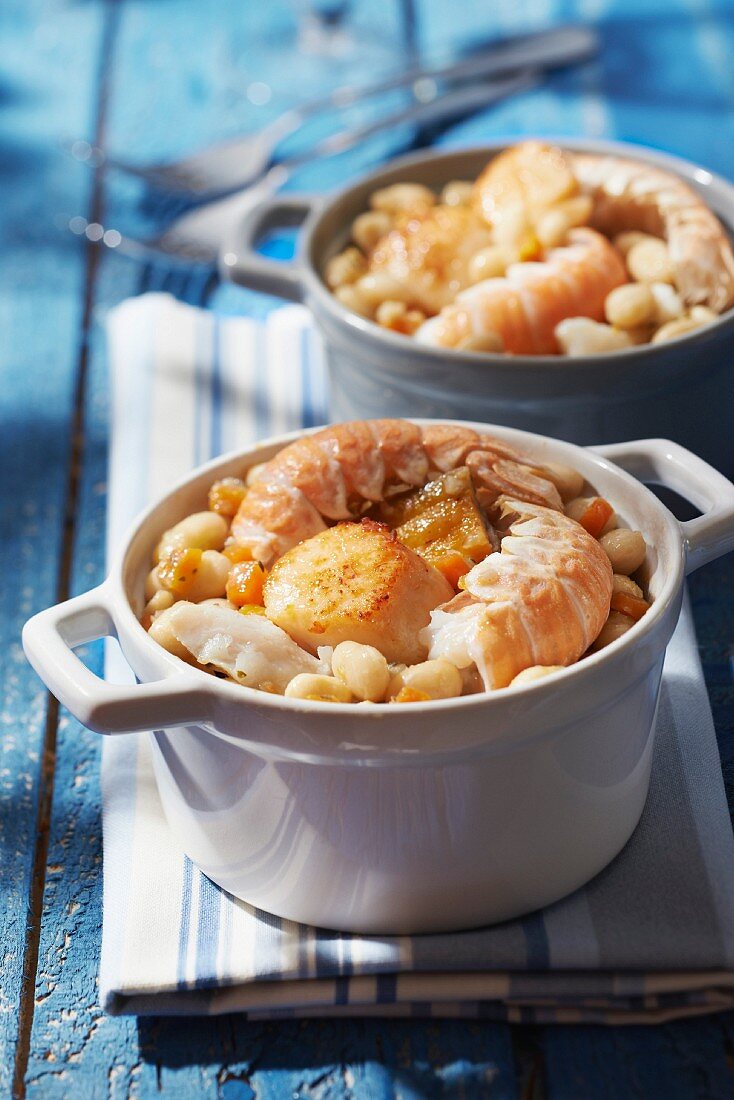 Individual seafood and white haricot bean casseroles