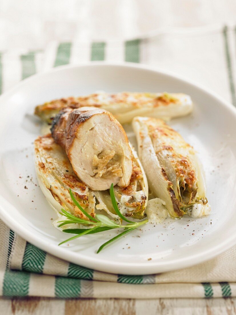 Chicken breasts stuffed with stewed onions, braised chicory