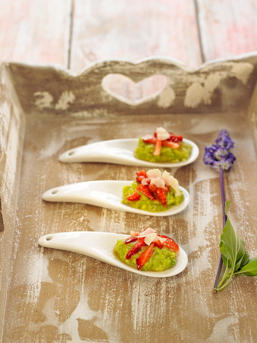 Guacamole, strawberry and thinly sliced fresh almond appetizers