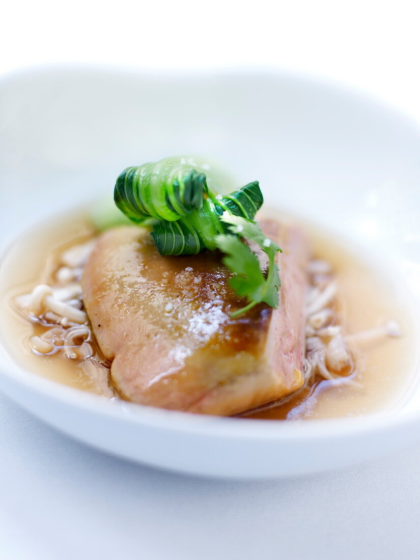 Shrimp Consommé with pan-fried foie gras,pak-choi cabbage and Gi lan tea
