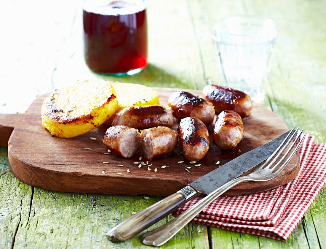 Grilled sausages with polenta patties