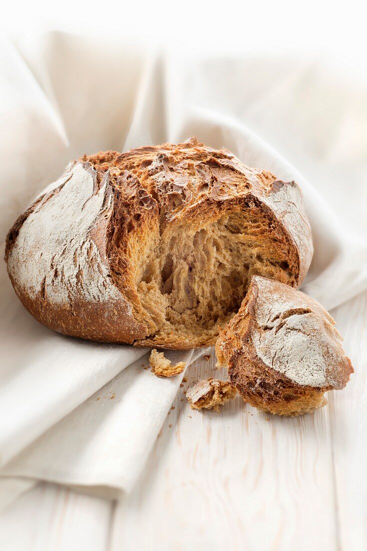 Round rye bread loaf by Gontran Cherrier