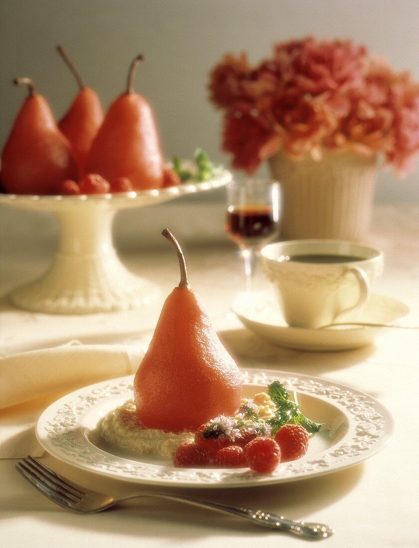 Whole Poached Pear with Raspberry Garnish