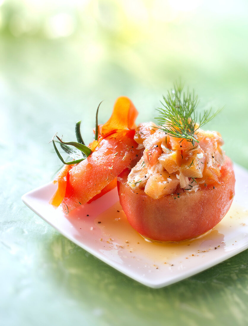 Tomato stuffed with smoked and fresh salmon