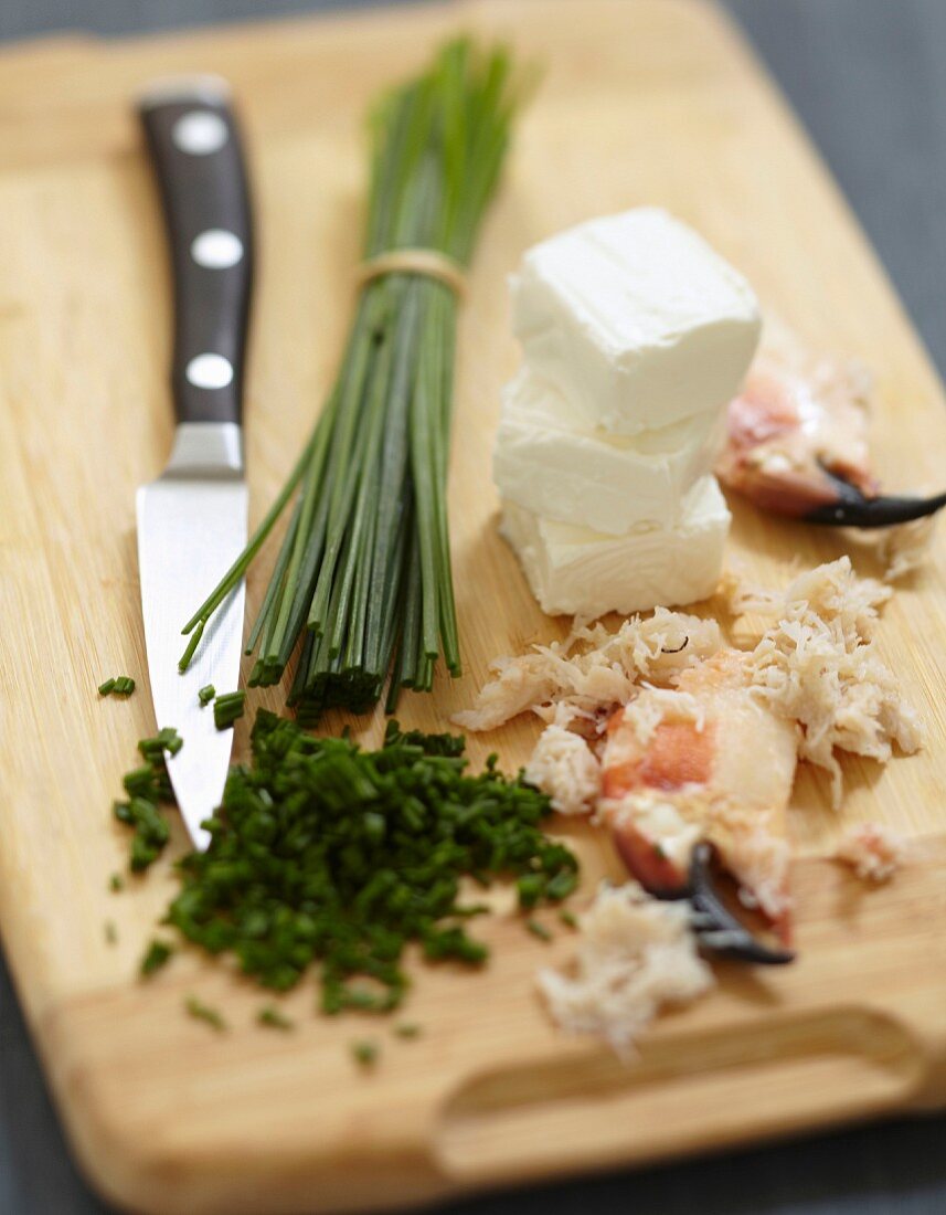 Preparing the Fromage frais with chives and crab meat
