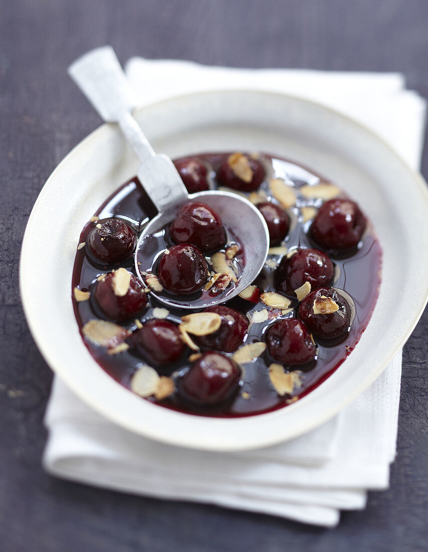Cherry and red wine soup with thinly sliced almonds