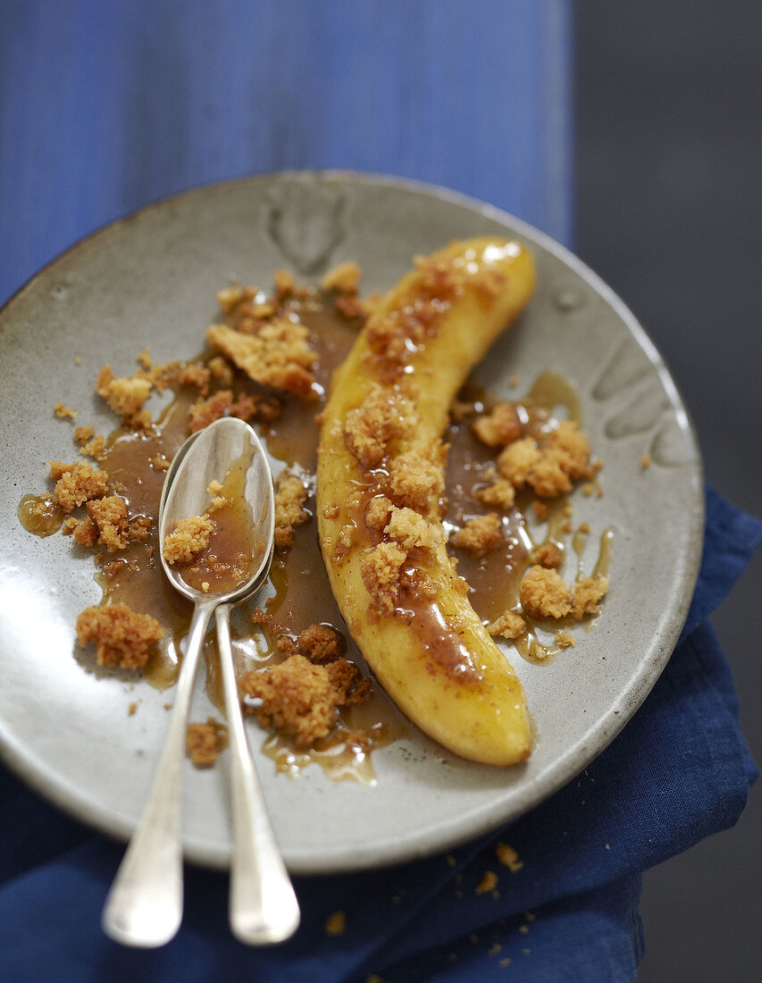 Roasted banana with toffee sauce and coconut crumble