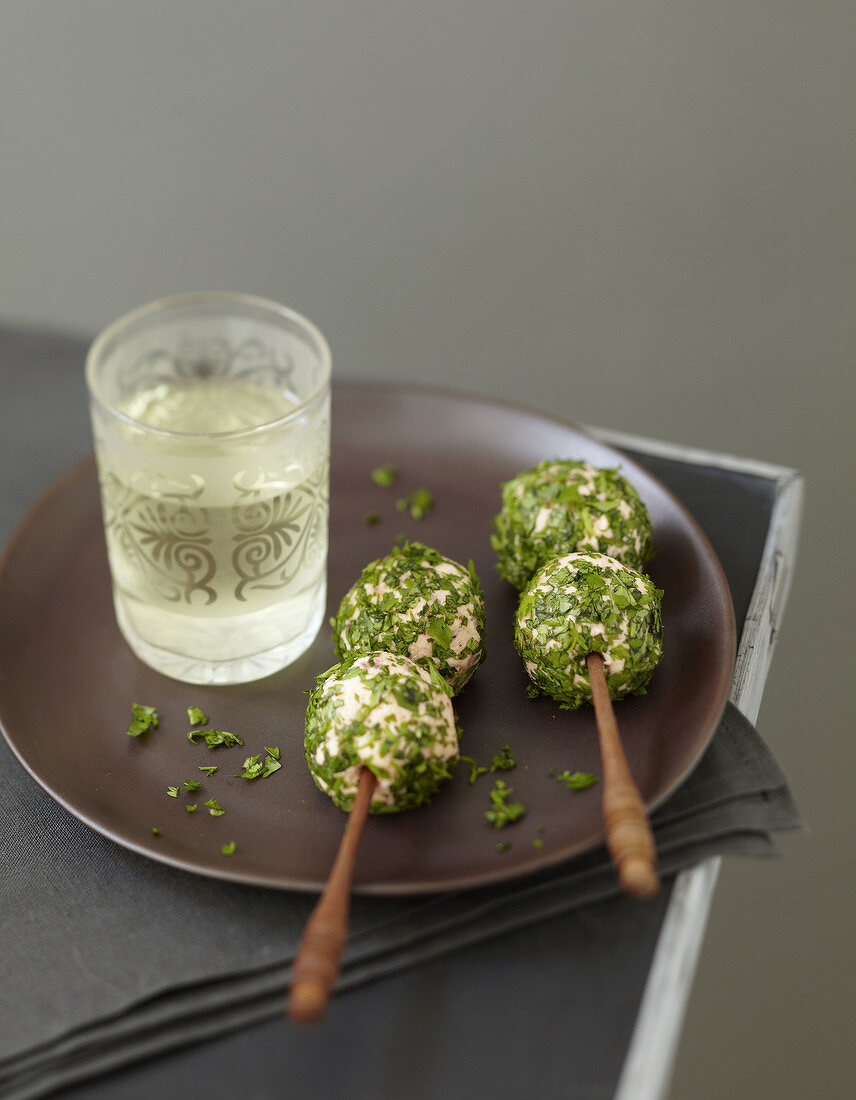 Salmon and parsley appetizers on sticks