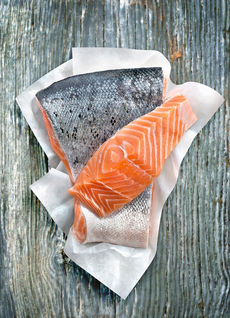 Piece of raw salmon on paper