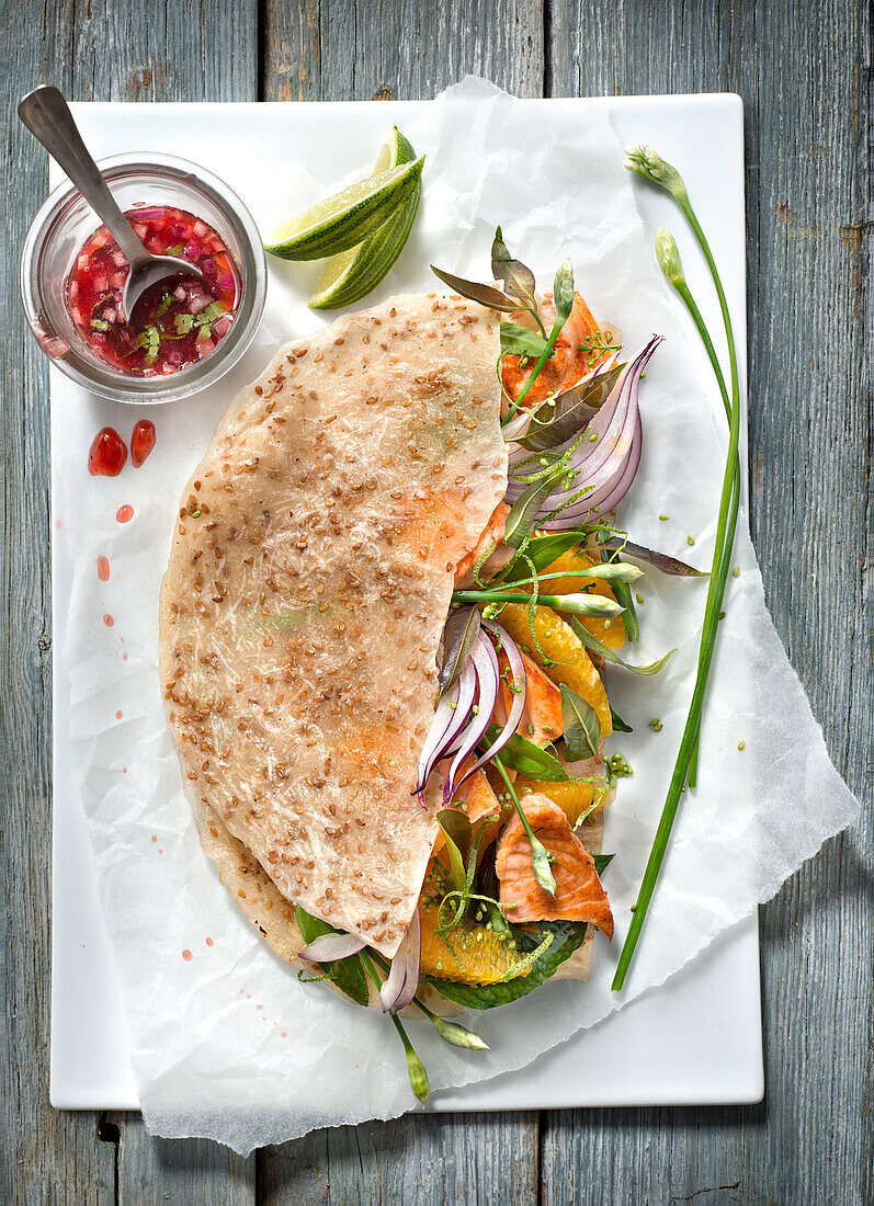 Grilled salmon and orange salad coconut galette with sweet and sour sauce