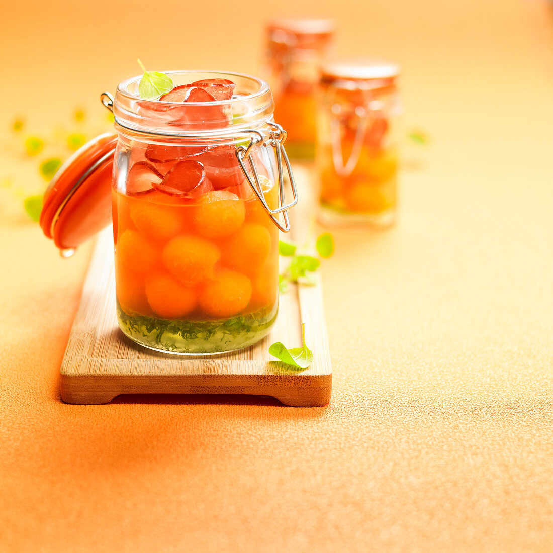 Melon ball salad with bacon and herb jelly