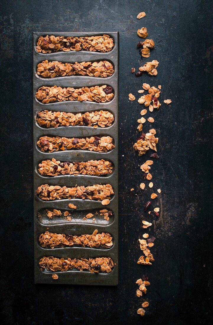 Mixed granola in a mould to make cereal bars