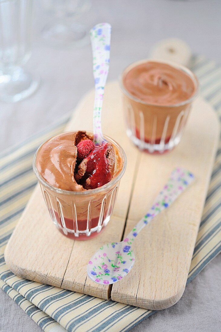 Chocolate mousse on a bed of raspberries