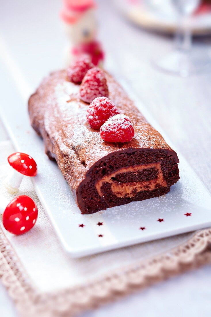 Chocolate and raspberry Christmas log cake