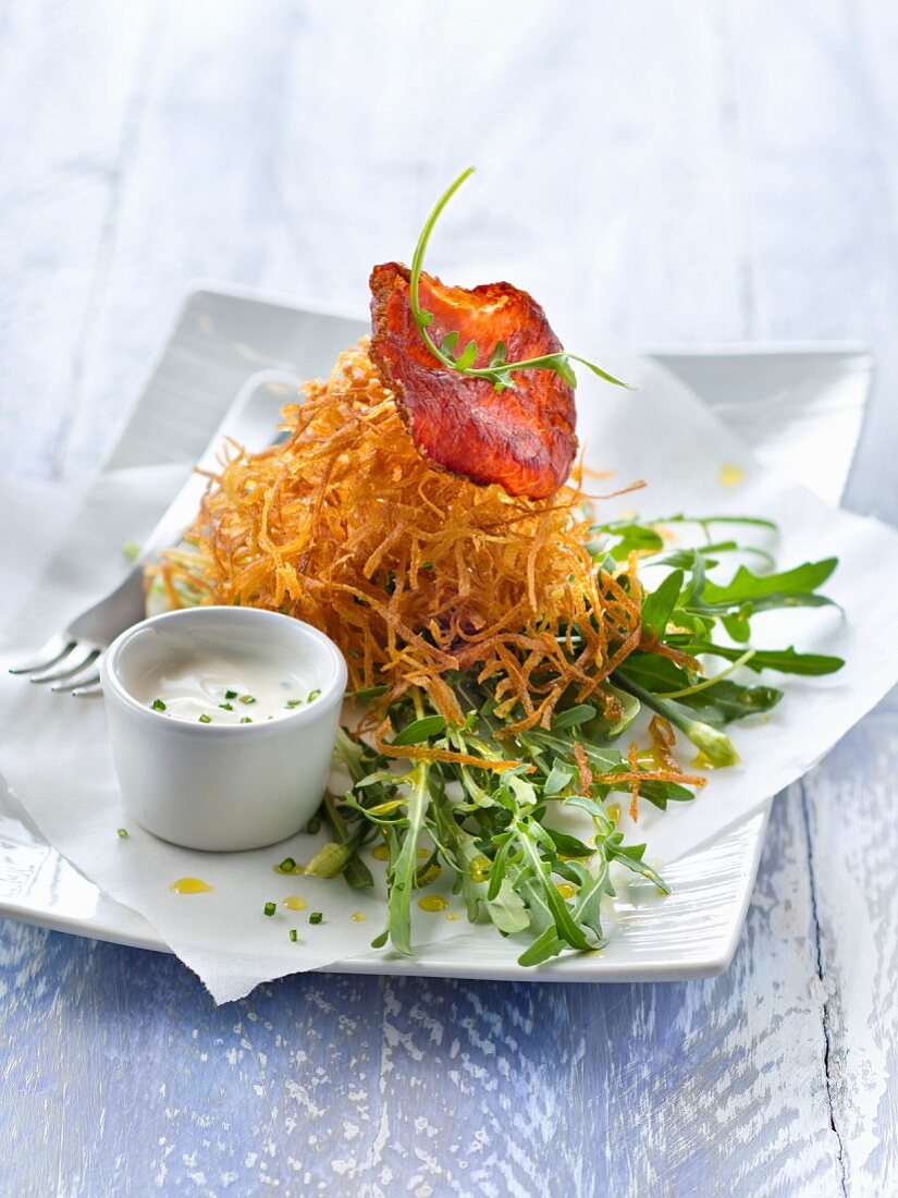 Deep-fried grated potatoes,crisp bacon and rocket lettuce salad ,creamy chive dressing
