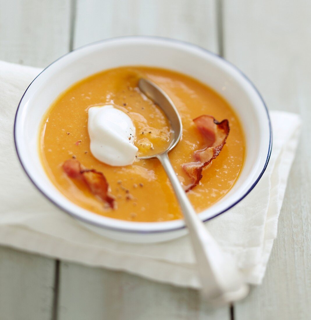 Cream of pumpkin soup with Fromage frais and crisp bacon