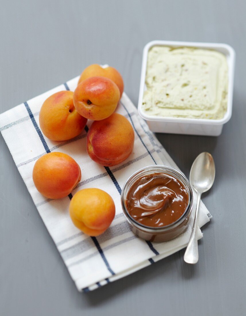 Ingredients for roasted apricots in toffee sauce with pistachio ice cream