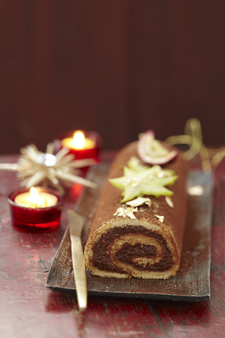 Bûche (French log cake) with chocolate and passion fruit