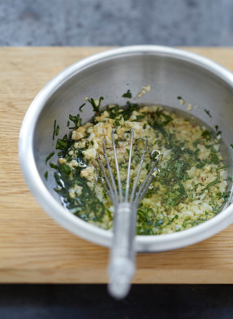 Prepare vinaigrette with hard-boiled egg and parsley