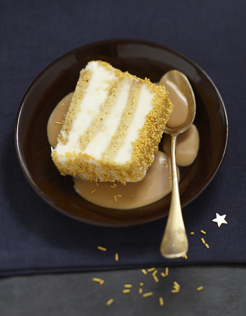 Slice of golden toffee log cake