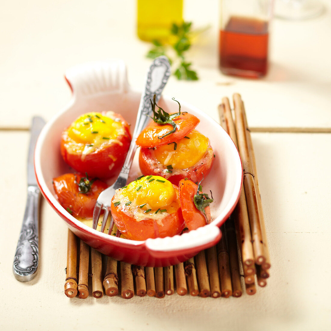 Coodle eggs baked in tomatoes