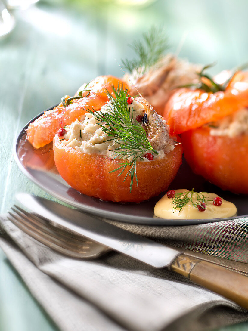 Tomatoes stuffed with shrimps, crab and mayonnaise