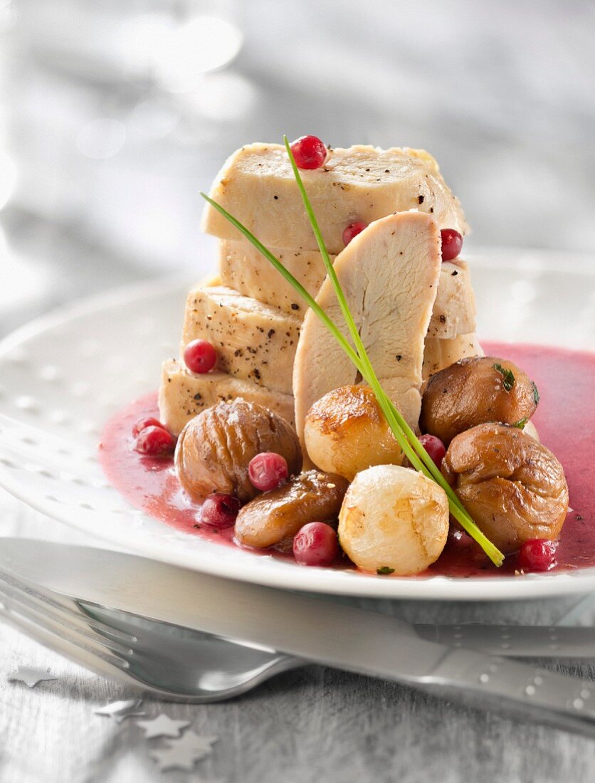 Roasted capon supreme with cranberry sauce and chestnuts