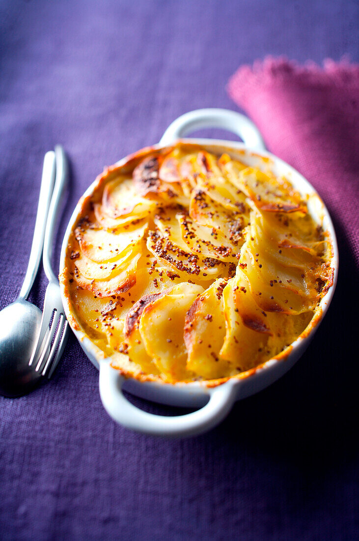 Potato and mustard seed gratin