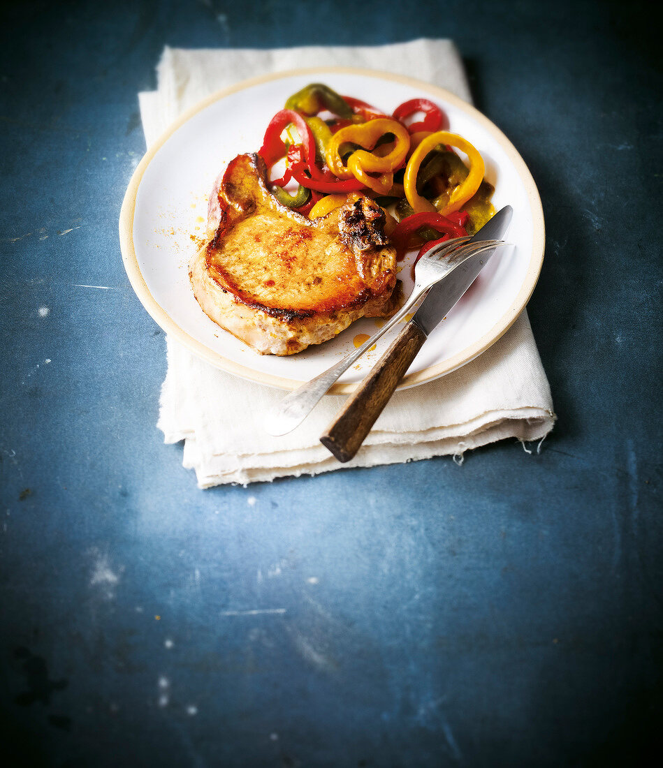 Pork chop with cumin and soft peppers