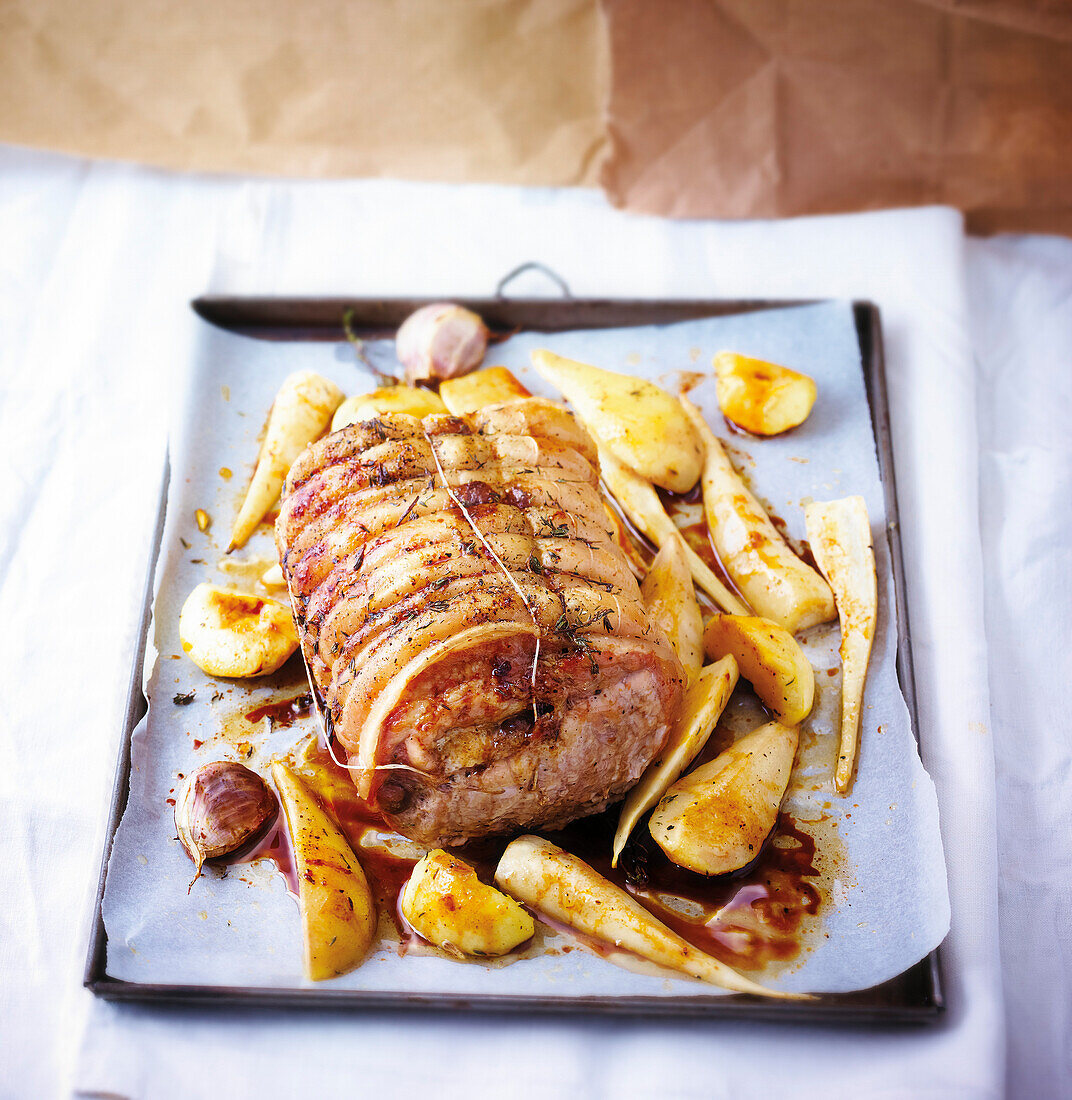 Pork roast with thyme and garlic,parsnips,potatoes and pears