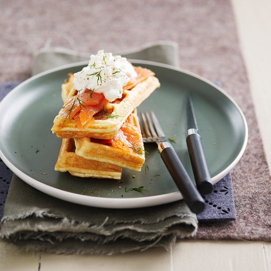 Waffles with smoked salmon and dill whipped cream