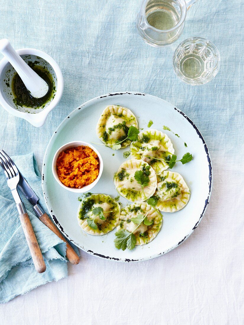 Raviolis stuffed with ricotta,pesto and cilantro ,mashed pumpkins